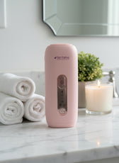 Luxury lifestyle photo of pink Skintekie IPL hair removal device with sapphire cooling