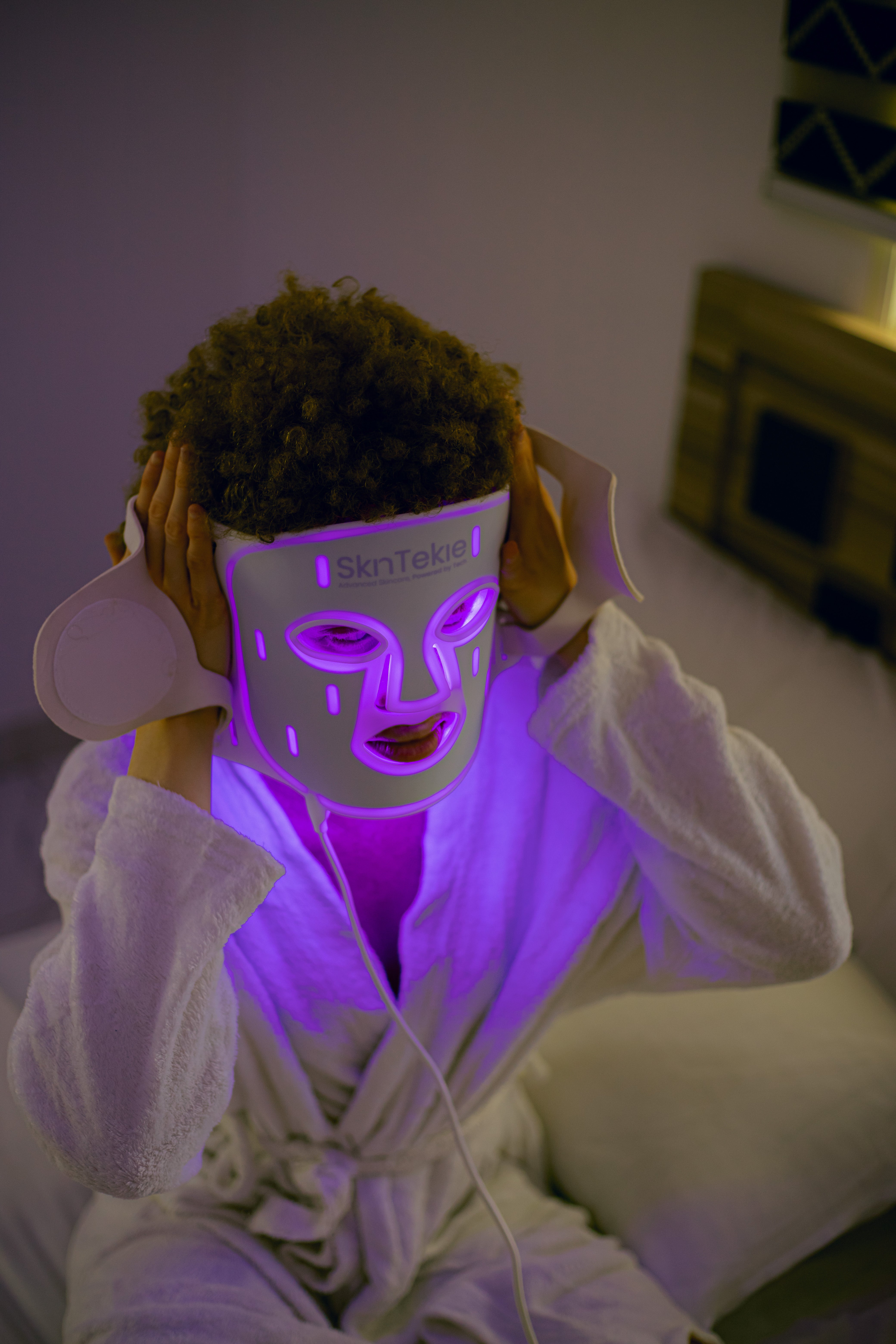 Close-up of Skintekie LED mask providing blue light therapy for acne treatment