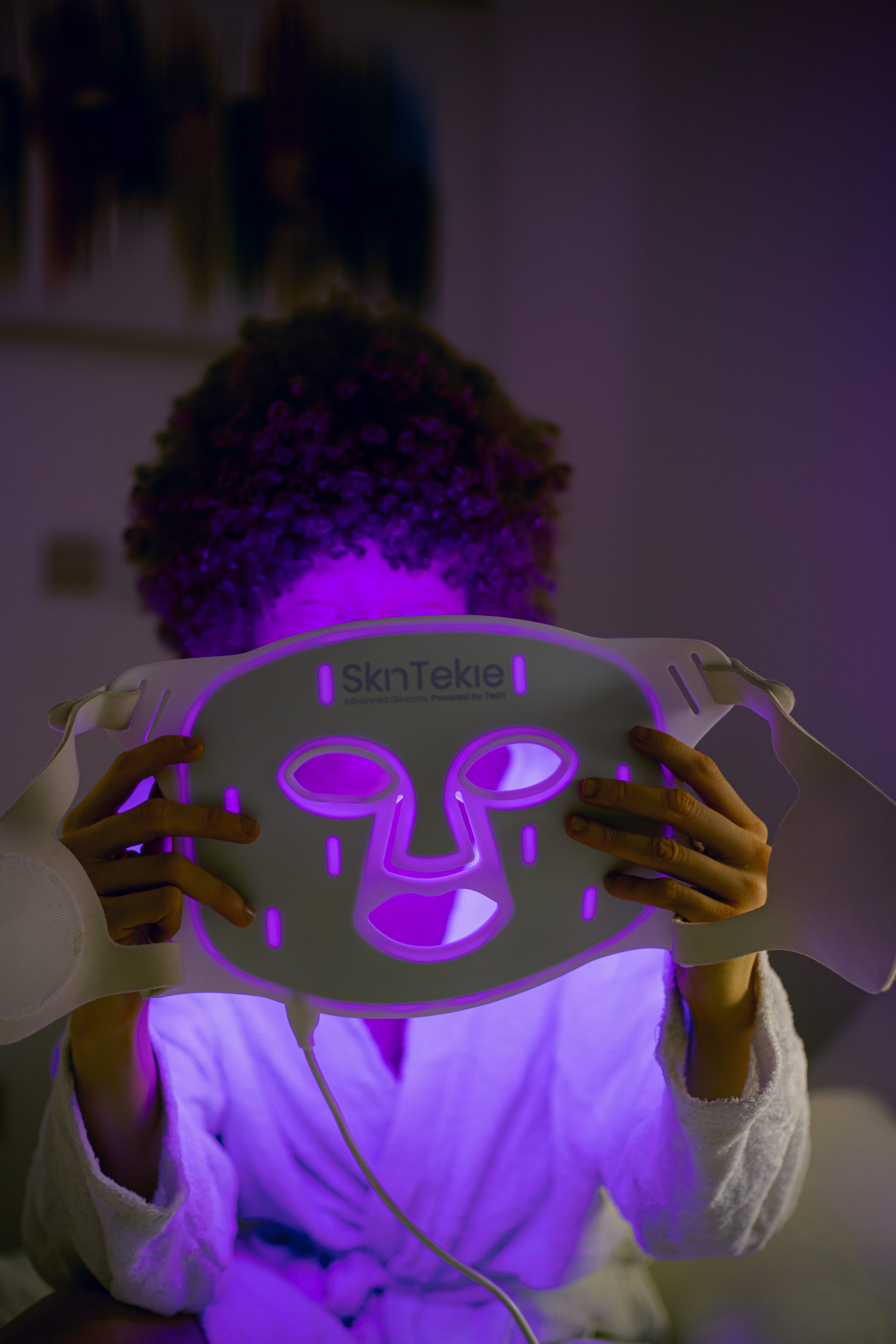 Close-up of Skintekie LED mask providing blue light therapy for acne treatment